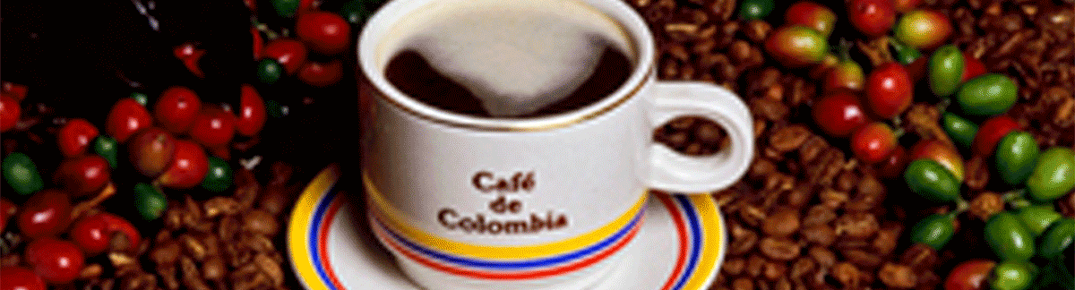CafeDeColombia.png This image shows a cup of coffee with many coffee beans spilled around it.