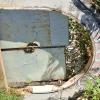 The arched door of the old house across from the train yard