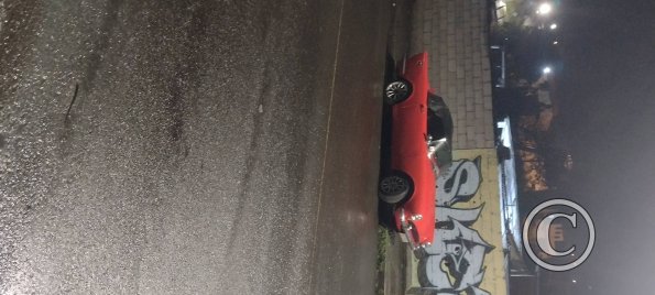 Little red sportscar, possibly a Sunbeam