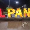 City name sign in Parque La Alborada at night