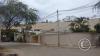 Houses on top of a dune seen from Calle El Medano and Calle Los Girasoles