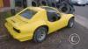 A yellow kit car