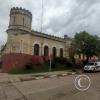 The building is the Police and Jail, built in 1891 at Calle 18 de Mayo y Av. Coronel Carlos Lecueder (2)