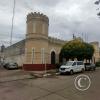 The building is the Police and Jail, built in 1891 at Calle Amaro Perreira Ramos y Av. Coronel Carlos Lecueder